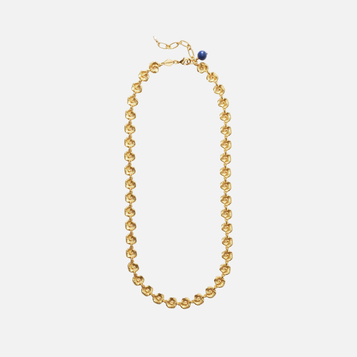 Gold necklace with a blue bead on a white background