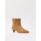 Tan ankle boot on a white background
