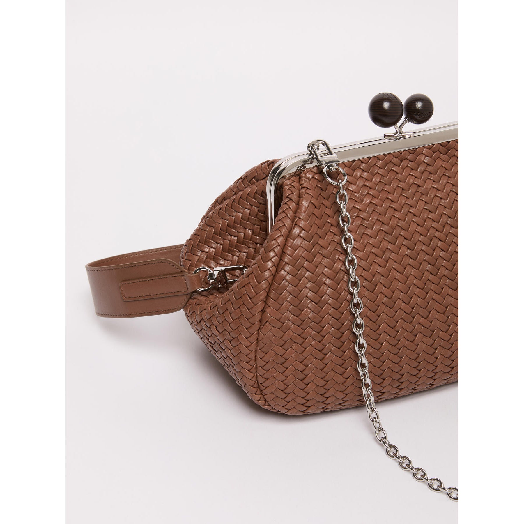 Brown woven handbag with a chain detail on a white background