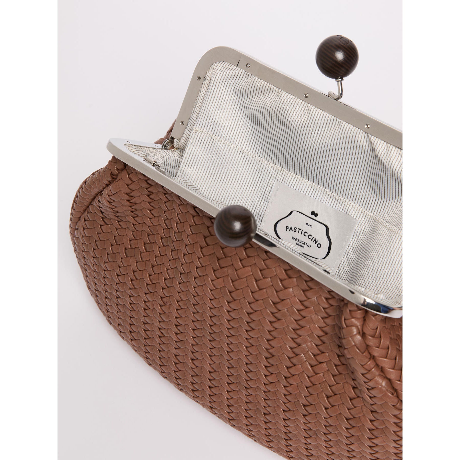Brown woven clutch bag with a metal clasp on a white background