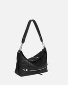 Black handbag with a shoulder strap on a white background