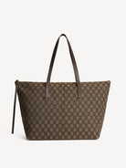 Brown patterned tote bag with brown handles on a light gray background