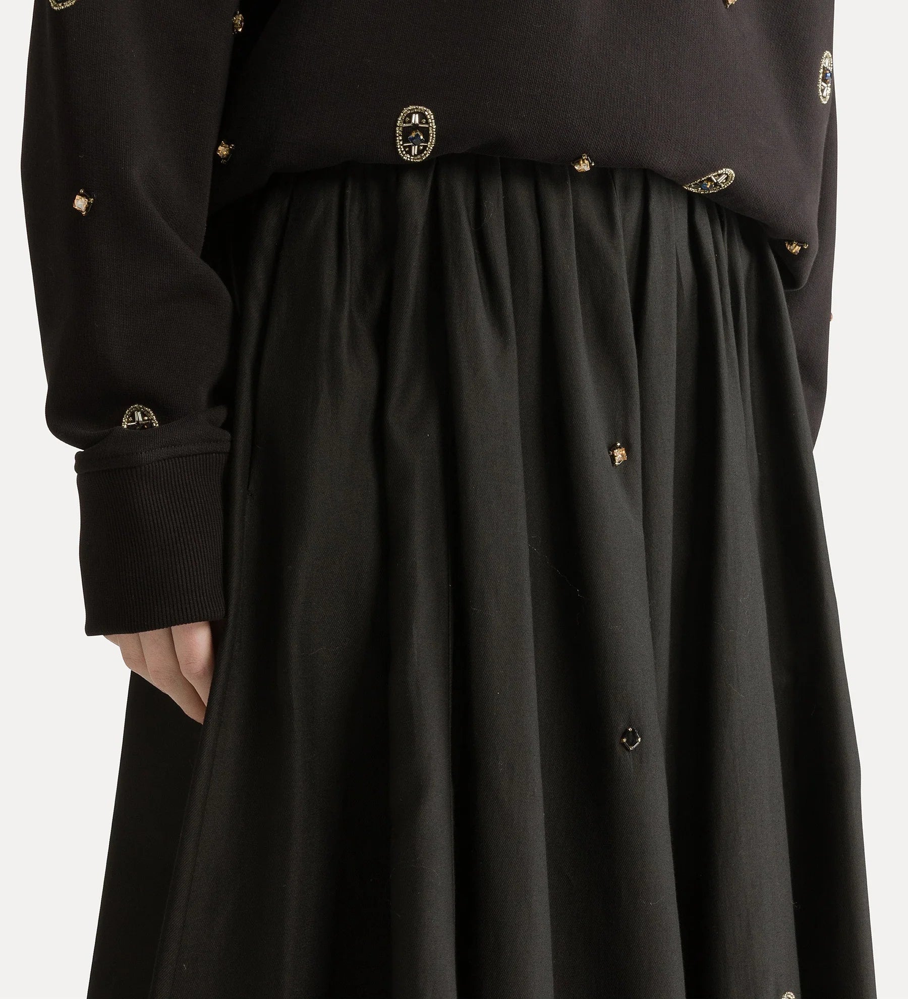 Black coat with gold buttons on a white background